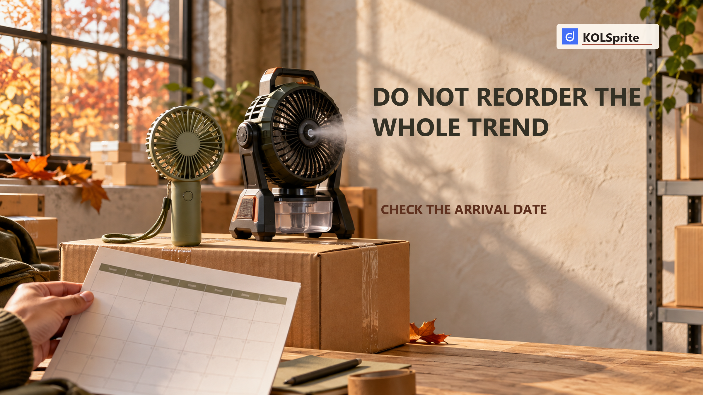 Two different portable fans on a packing table beside an autumn shipping calendar and an unsent reorder slip.